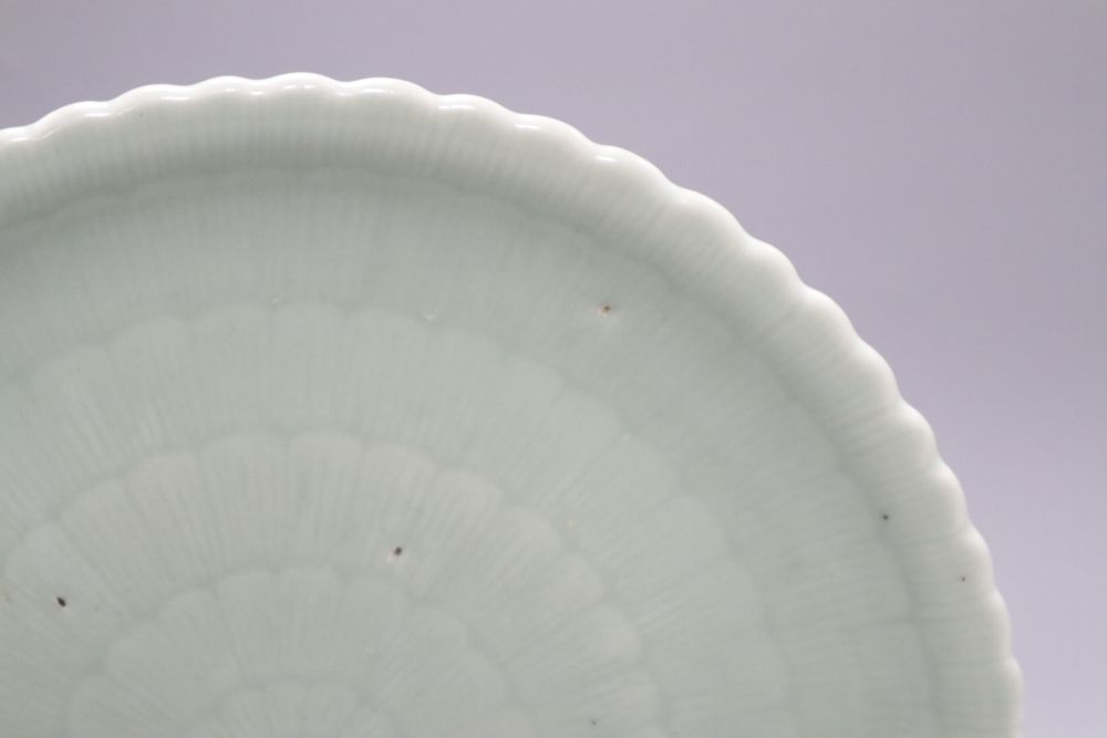 A Chinese celadon glazed dish, 18th / 19th century, Qianlong mark, diameter 28cm